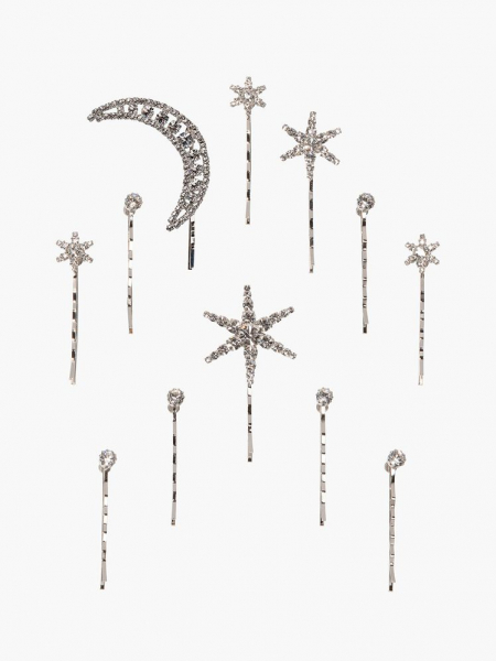 Jennifer Behr Supernova Bobby Pin Set set of silver moon and star bobby pins on light gray background