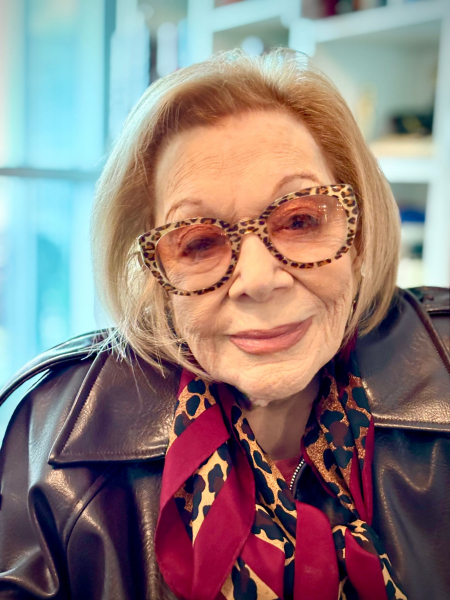 Image may contain Clothing Coat Jacket Adult Person Face Head Photography Portrait Happy Smile and Scarf